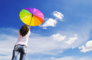 person holding a colorful umbrella