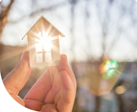 Hand holding a house into the sun to show how smart it is to choose us