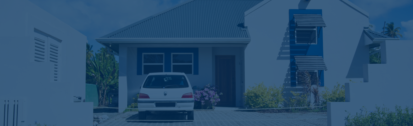 Exterior front of a home with a car parked in front